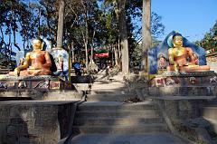 Kathmandu Swayambhunath 07 Two Buddha Statues At Entrance Gate